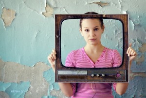 young woman with old tv frame photo